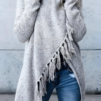 Cozy fringed gray bohemian wool cowl neck sweater with long sleeves, modeled outdoors, perfect for chic winter wear.