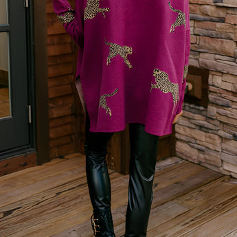 Fuchsia ethnic pattern sweater with boho chic embroidery, featuring long sleeves and intricate designs in shades of purple, pink, and magenta.