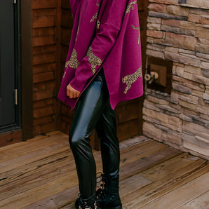 Fuchsia ethnic patterned sweater featuring boho chic embroidery, showcasing long sleeves and intricate details.