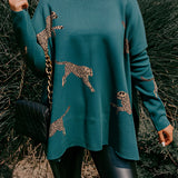 Fuchsia ethnic pattern sweater featuring boho chic embroidery, shown in green color, size XL. The sweater has a round neck, long sleeves, and a waist-length fit.