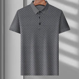 Men's polo shirt featuring a geometric blue triangle pattern, in gray color and size XL, with short sleeves and a classic collar design.