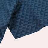 Men's polo shirt featuring a geometric blue triangle pattern, designed with short sleeves and made of a jersey mesh fabric, suitable for casual or sportswear occasions.