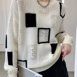Women's black and white geometric crewneck wool sweater with checkerboard and abstract knit design, featuring long sleeves and cozy winter fashion.