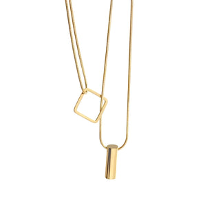 Elegant minimalist necklace featuring a geometric gold bar and square pendant on a delicate chain.