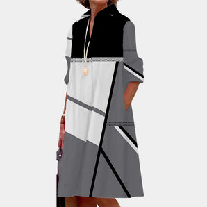 Geometric Pattern Midi Dress in monochrome colors of black and gray, featuring long sleeves and a structured collar. This formal wear piece is styled for plus-size, shown in 3XL, and is designed with a flattering waistline suitable for various events.