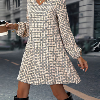 Geometric Print Long Sleeve Mini Dress in black featuring a chic geometric design, long sleeves, and a short hemline, perfect for casual fall fashion.