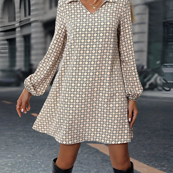 Woman wearing a beige geometric print long sleeve mini dress, showcasing casual chic fall fashion.