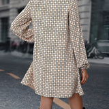 Woman wearing a geometric print long sleeve mini dress, styled with casual chic fall fashion.