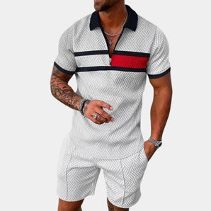 Men's polo and shorts set featuring a geometric print in a grey color, styled as a casual summer outfit. The polo shirt has a collar and short sleeves, and the set is shown in size 3XL with a wit color scheme.
