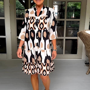 Chic and lightweight knee-length geometric V-neck summer dress in Astratto Marrone pattern, size 3XL, featuring a stylish design with short sleeves, perfect for warm weather fashion.
