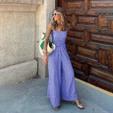 A blue gingham wide-leg jumpsuit in an XL size, featuring a sleeveless design and checkered pattern suitable for summer wear.