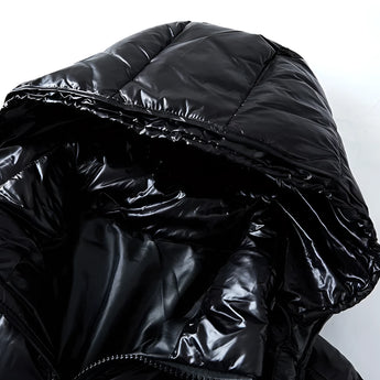 Glossy black insulated hooded puffer jacket with a shiny finish, featuring long sleeves and a sleek, luxurious design.