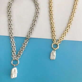 Gold chunky chain necklace with custom monogram initial pendant.