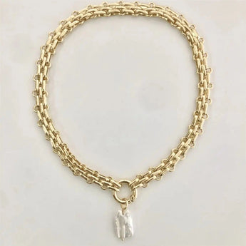 Gold chunky chain initial pendant necklace with custom monogram, featuring a circular metal pendant, a stylish and personalized fashion accessory.