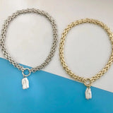 Gold chunky chain initial pendant necklace with custom monogram, featuring a bold metal design.