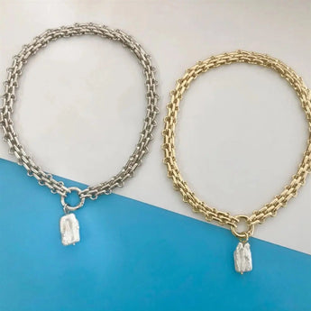 Gold chunky chain initial pendant necklace with custom monogram, featuring a bold metal design.