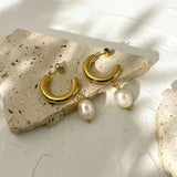 Gold Crescent Pearl Drop Earrings featuring a modern luxury design, perfect for weddings and bridal accessories.