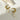Gold crescent pearl drop earrings with delicate chain and circular design, featuring natural beige pearls and gold metal accents.
