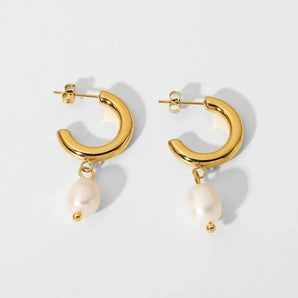 Gold crescent pearl drop earrings with modern luxury design, featuring gold metal and natural pearl, elegant fashion accessory.