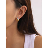 Woman wearing Gold Crystal Heart Stud Earrings – 18K Plated Romantic Gift visible on her ears.
