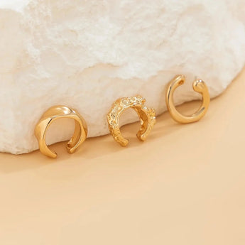 Gold diamond-studded hoop earrings for women, featuring a luxurious design with circular metal hoops and embedded diamonds, perfect as a high-end fashion accessory.