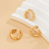 Gold diamond-studded hoop earrings for women, luxury fashion jewelry, featuring circular gold design with sparkling diamonds.