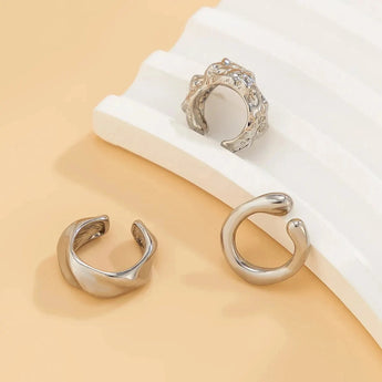 Gold diamond-studded hoop earrings, luxury fashion jewelry for women, featuring a circular design with natural materials and metal, elegant and glittering in silver tones.