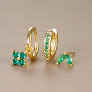 Gold and emerald hoop earrings featuring circular and rectangular shapes with a luxurious design, combining gleaming gold metal and vibrant emerald gemstones, ideal as a sophisticated jewelry gift for her.
