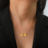 A gold heart-shaped pendant necklace worn around the neck, featuring a romantic love gesture, suitable for couples.