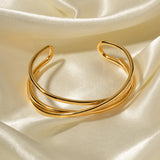 Gold heart bracelet featuring an adjustable minimalist open heart bangle design, ideal as a romantic gift.
