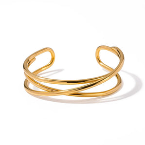 Gold heart bracelet with an adjustable minimalist open heart bangle design in gold tone, ideal as a romantic gift.