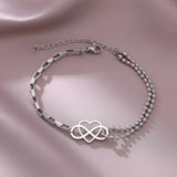 Elegant silver heart charm bracelet, adjustable, dainty design, ideal for gifting, featuring circle and natural material elements, perfect fashion accessory.