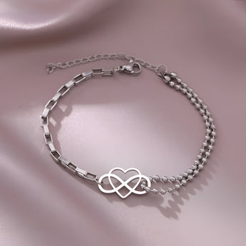 Elegant silver heart charm bracelet, adjustable, dainty design, ideal for gifting, featuring circle and natural material elements, perfect fashion accessory.