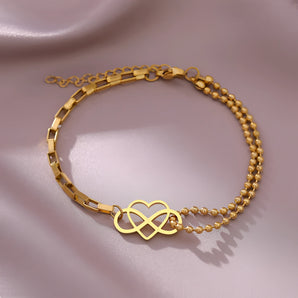 Elegant adjustable gold heart charm bracelet featuring dainty design, made of metal, perfect as a jewelry gift.