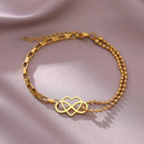 Gold heart charm bracelet with adjustable chain, featuring a dainty and elegant design, perfect as a jewelry gift.