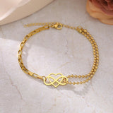 Gold heart charm bracelet made of natural material with adjustable dainty chain, featuring elegant jewelry design, fashion accessory.