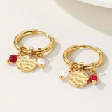 Gold hoop earrings with dangle pearl and textured disc charms by YA-CHAN, featuring natural materials and a stylish design.
