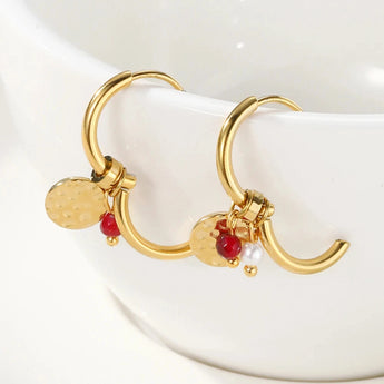 Gold hoop earrings featuring dangle pearl and textured disc charms, designed by YA-CHAN, made of metal and natural materials.