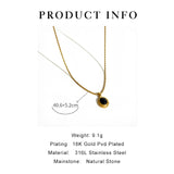 Gold locket necklace with black onyx and white stone, showcasing two-tone design on a white background.