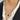 Gold locket necklace featuring black onyx and white stone, displayed on a mannequin's neck with a blazer backdrop.