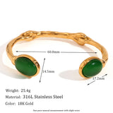 Gold Pink Cabochon Bracelet with green gemstone accents and gold metal detailing, luxury designer jewelry for women, featuring an elegant and fashionable design.