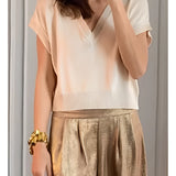 Gold pleated metallic trousers with a luxurious, chic design suitable for party wear, featuring a shimmering texture.