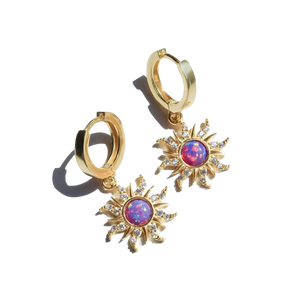 Gold sunburst earrings with pink opal, featuring celestial dangle hoops and intricate oval and circular designs.
