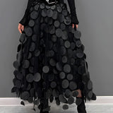 Gothic black high-waist layered circle skirt with a flowing design, showcasing an alternative fashion style.