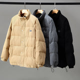 Gray corduroy men's urban winter jacket featuring a high collar and insulated interior, designed as outerwear with stylish sleeve and fashion design elements.