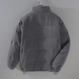 Gray corduroy men's urban winter jacket with a high collar and insulated design, featuring long sleeves and a stylish, textured fabric.