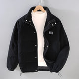 Gray corduroy men's urban winter jacket in Nero color, size 3XL, featuring a high collar, long sleeves, button details, and insulated design.