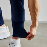Gray men's tapered joggers with a lightweight design, featuring an athletic fit, suitable for sportswear.