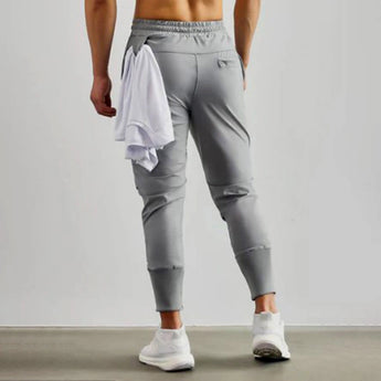 Men wearing gray tapered joggers, featuring a lightweight athletic design with a focus on comfort and flexibility, suitable for sportswear and casual wear.
