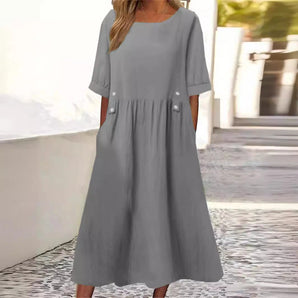 Gray midi dress with elbow sleeves, featuring a loose-fit design perfect for summer streetwear. The dress is made of cotton and falls to the knee, suitable for casual day wear. It is shown in a size 3XL.